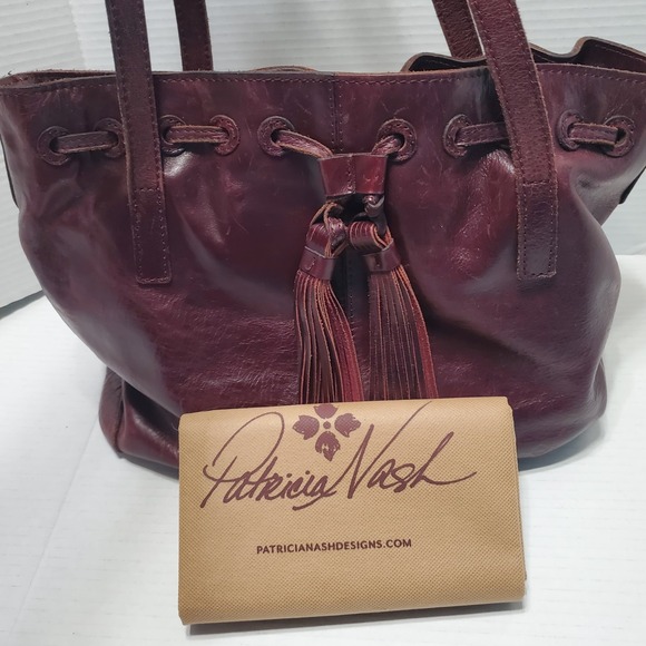 Patricia Nash Burgundy Leather Tote Bag Shoulder Purse Tassels Drawstring Hobo - Picture 1 of 12
